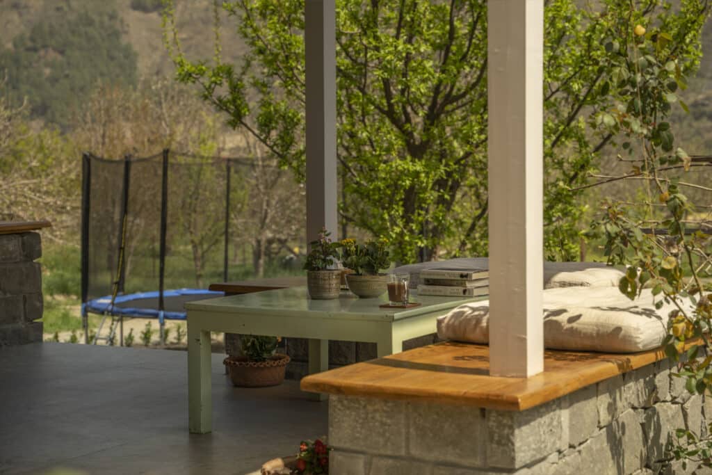 Outdoor patio with wooden table and seating